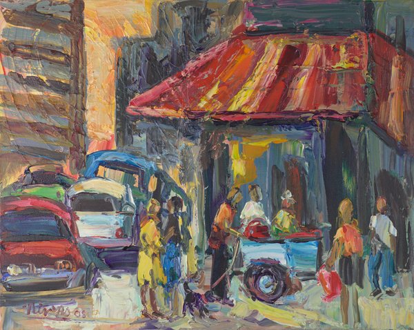 People gather at a food cart under a red-and-orange striped awning on a city street.