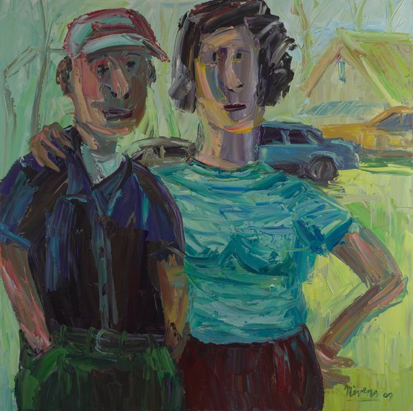 A man in a red cap and dark shirt puts his arm around a woman in a teal top with her hand on her hip, with a blue car and houses behind them.